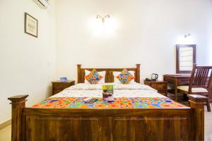 Postel nebo postele na pokoji v ubytování Hotel Raj Kothi Jaipur airport