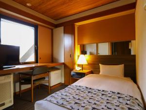 Postel nebo postele na pokoji v ubytování The Hedistar Hotel Narita
