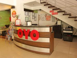 a store with a ovo sign on the counter at Super OYO 107 Orange Nest Hotel in Manila