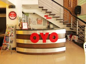 a store with aoops sign on a counter in a store at Super OYO 107 Orange Nest Hotel in Manila