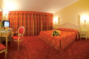 Postel nebo postele na pokoji v ubytování Hotel Motel Gold