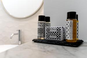 two bottles of essential oils sitting on a bathroom counter at Bellini Suite in Naples