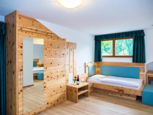 Postel nebo postele na pokoji v ubytování Hotel Feldrand