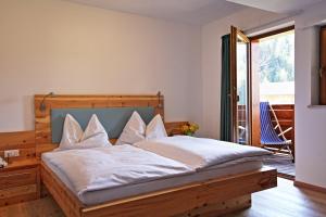 Postel nebo postele na pokoji v ubytování Hotel Feldrand