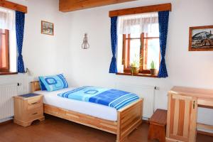 Katil atau katil-katil dalam bilik di Penzion v Podhradí