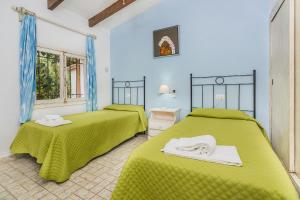 Ein Bett oder Betten in einem Zimmer der Unterkunft Villa Can Boseta by SunVillas Mallorca