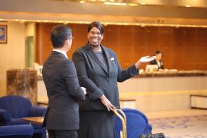 two men standing next to each other in a room at Rihga Royal Hotel Hiroshima in Hiroshima +78 photos