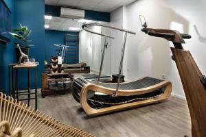 a hair salon with a chair and a hair treatment room at Hôtel Les Deux Girafes in Paris