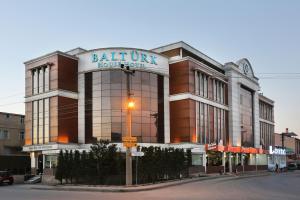 a building with a sign on the front of it at Balturk House Hotel in Kocaeli