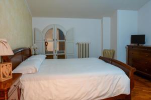 Katil atau katil-katil dalam bilik di Locanda Al Portone