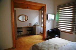Postel nebo postele na pokoji v ubytování Belizia Hotel + 25 fotografií