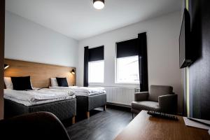 Postel nebo postele na pokoji v ubytování 201 Hotel
