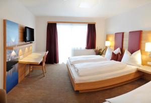 Postel nebo postele na pokoji v ubytování Hotel Sonnschupfer
