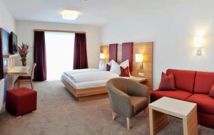 Postel nebo postele na pokoji v ubytování Hotel Sonnschupfer
