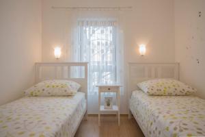 Postel nebo postele na pokoji v ubytování Apartment Petra