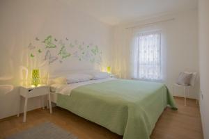 Postel nebo postele na pokoji v ubytování Apartment Petra