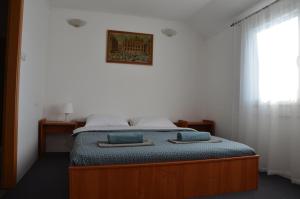 Postel nebo postele na pokoji v ubytování Enka apartmani