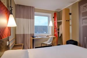 Postel nebo postele na pokoji v ubytování Ibis Münster City