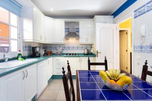 A kitchen or kitchenette at ViVaTenerife - Villa with pool, jacuzzi and sea view