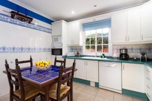 A kitchen or kitchenette at ViVaTenerife - Villa with pool, jacuzzi and sea view