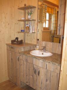 a bathroom with a sink and a mirror at Pichelhütte in Murau +28 photos