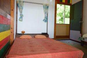 Een bed of bedden in een kamer bij Asian guesthouse Border