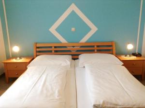 Katil atau katil-katil dalam bilik di Gasthof-Pension Silvia