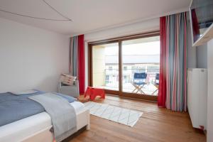 Posteľ alebo postele v izbe v ubytovaní Frauscher Hafen-Apartments