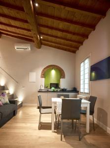 a kitchen and living room with a table and chairs at Pergola35 in Florence