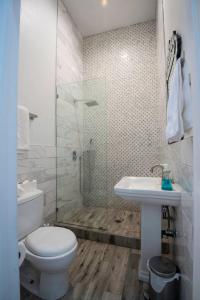 A bathroom at Five BR - Sleeps 10! Steps from French Quarter