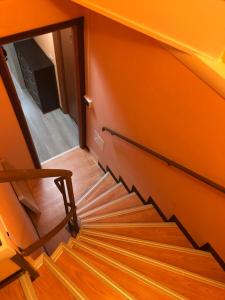 a staircase in a room with a mirror at Locanda Beatrice in Sanremo