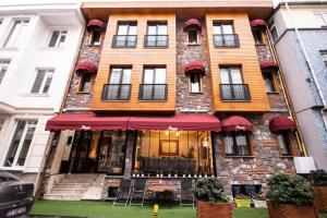 a large building with a restaurant in front of it at Pruva Hotel in Istanbul