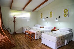 Postel nebo postele na pokoji v ubytování Easter Island Ecolodge