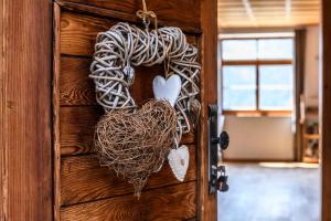 a door with a heart made out of rope at Chalet "Altes Schulhaus" in Schruns