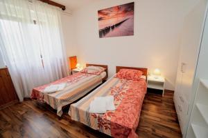 Posteľ alebo postele v izbe v ubytovaní Apartment Cici