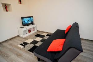 Televízia a/alebo spoločenská miestnosť v ubytovaní Apartment Cici