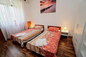 Posteľ alebo postele v izbe v ubytovaní Apartment Cici