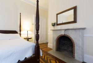 a bedroom with a bed and a fireplace at The Salem Inn in Salem