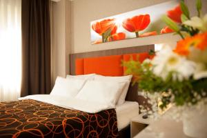 Postel nebo postele na pokoji v ubytování Birbey Hotel