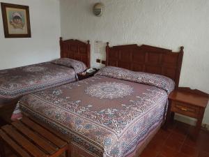 Postel nebo postele na pokoji v ubytování State Inn