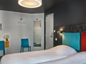 Кровать или кровати в номере Hôtel des Métallos