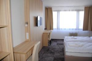 Posteľ alebo postele v izbe v ubytovaní Hotel Labe