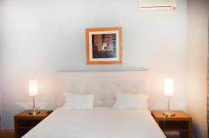Uma cama ou camas num quarto em Urban Flamingo Residence