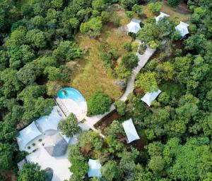 an aerial view of a house in the forest at Mikado Natural Lodge in Playa Avellana