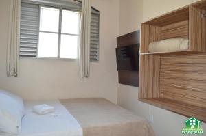 מיטה או מיטות בחדר ב-Hotel e Restaurante Residencial