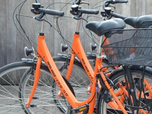 two orange bikes are parked next to each other at Hotel Gasthof Kruse in Nottuln