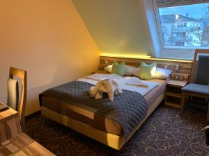 Llit o llits en una habitació de Hotel Seemeile