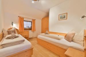 A bed or beds in a room at Appartements Umfahrer