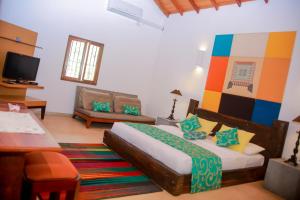 Cama ou camas em um quarto em Kurumba Villas