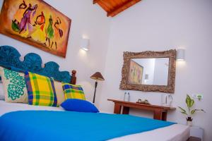 Cama ou camas em um quarto em Kurumba Villas